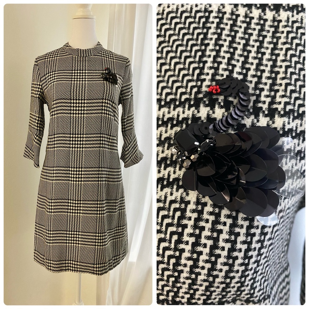 Black dress with swan brooch